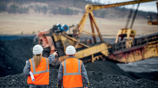 Coal mine workers in an open pit shutterstock 646064452