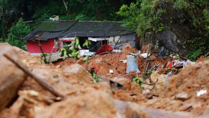 A house stands damaged by a landslide caused by heavy rains in the southeastern coast of Guaruja Sao Paulo state Brazil shutterstock 2162319859